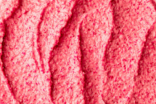 Fruit pink ice cream. Yogurt smoothie with fresh fruits and berries. Ice cream texture. Delicious sweet dessert close-up as background.