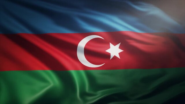 Close-up of the national flag of Azerbaijan with its blue, red, and green stripes and white crescent and star, rippling in the wind