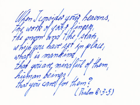 Blue cursive handwriting on a white background displays a passage from Psalm 8, verses 3-5. The script is fluid with an elegant flow
