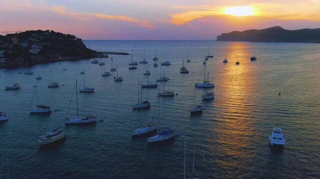 A magical bird's eye view of the harbor with sailboats at sunset, Santa Ponsa, Palma de Mallorca.