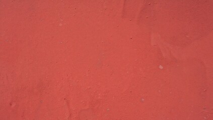 Fototapeta premium Red Textured Surface with Subtle Imperfections in Natural Light