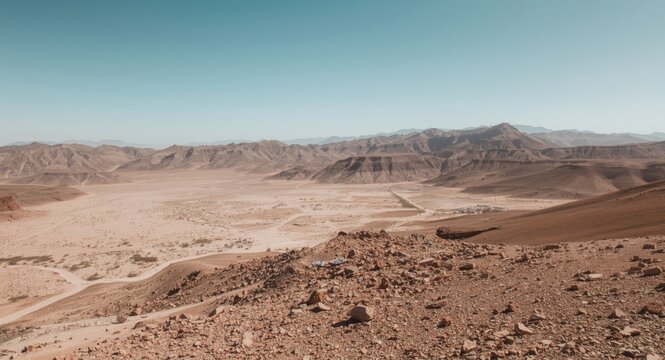 Desert Landscape with Rocky Terrain and Clear Blue Sky Viewing Distance