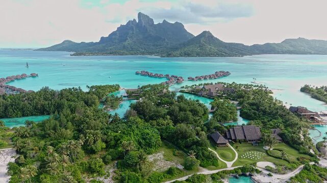 Bora Bora, French Polynesia. Drone Shot of Luxury Hotel Resort Buildings and Bungalows Over Turquoise Lagoon