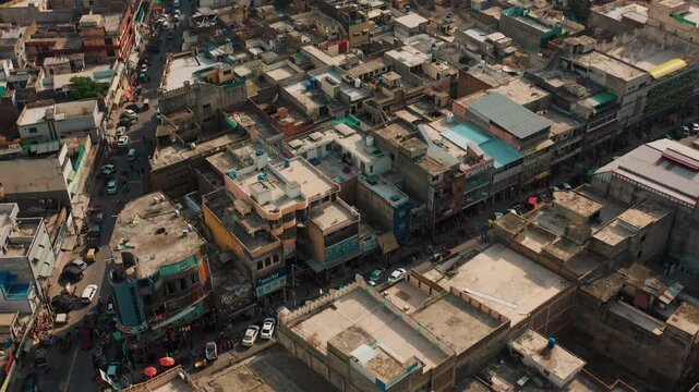 Overhead Drone View of Colorful Rooftops Water Tanks and Narrow Gully Street in Pakistan