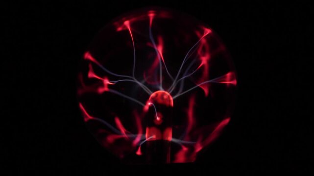 Close-up of the plasma ball during operation. The discharge color is shades of red.