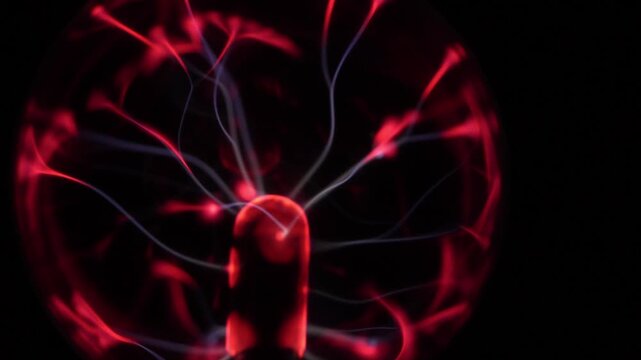 Close-up of the plasma ball during operation. The discharge color is shades of red.