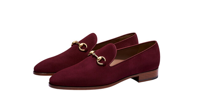 Burgundy suede loafers with gold horsebit detail, isolated on transparent background
