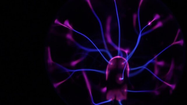 Close-up of the plasma ball in operation. The discharge color is shades of purple.