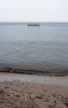 Small boat anchored near the shore