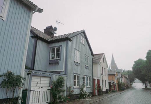 Wooden houses on rainy street