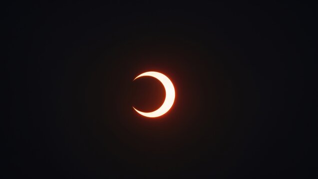 Partial Solar Eclipse Against a Dark Background with Glowing Sunlight