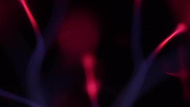 Close-up of electrical discharge rays from a plasma ball.
