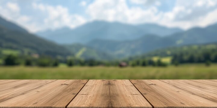 Wooden Tabletop in Foreground with Blurred Mountain Landscape Background on a Sunny Day