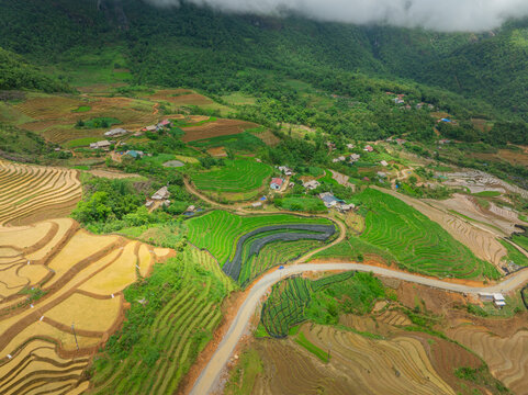 The pouring water season makes the terraced fields of Y Ty, Lao Cai province, Vietnam appear with brown soil blending with the beautiful sky