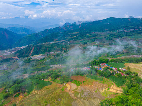 The pouring water season makes the terraced fields of Y Ty, Lao Cai province, Vietnam appear with brown soil blending with the beautiful sky