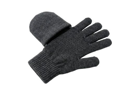 Dark grey knitted winter glove isolated on black background