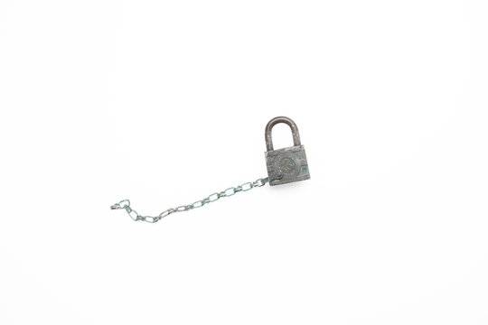 Vintage bronze padlock, heavy patina and paint splatter, with attached chain, white background