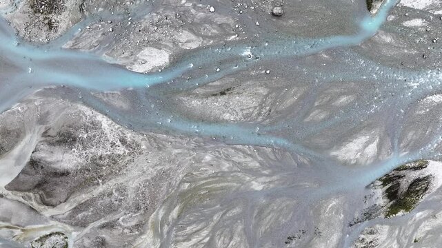 Aerial view of turquoise glacial stream of Nigardsbreen glacier, part of Jostedalsbreen in Norway
