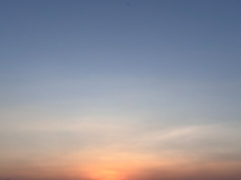 Stunning twilight sky gradient featuring soft pastel hues melting into bright orange. A tranquil and empty backdrop for sky replacement and creative projects.