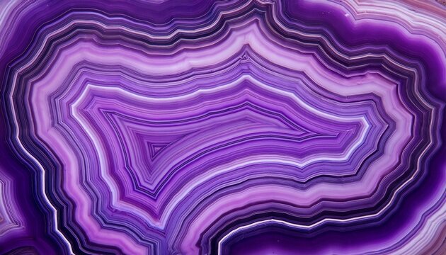 close up shot of a stunning purple agate mineral with intricate band patterns colorful detail