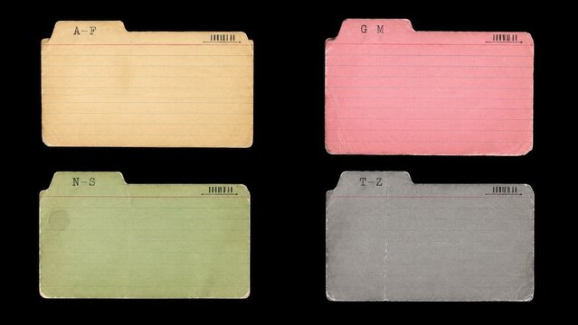 Four vintage colored index cards isolated on black background