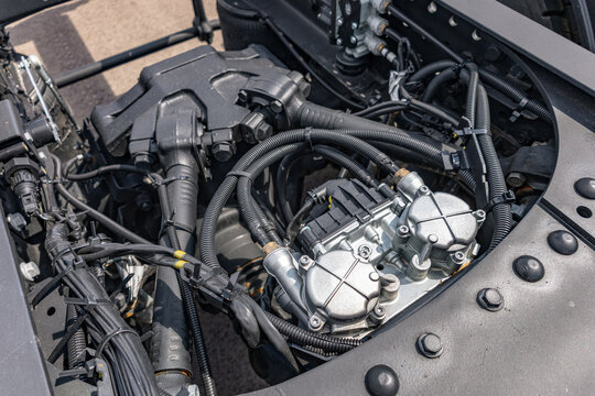 Semi truck chassis EBS brake control valve valve module. Modern commercial heavy duty transport vehicle air pneumatic system component on frame with long haul tractor technical engineering details.