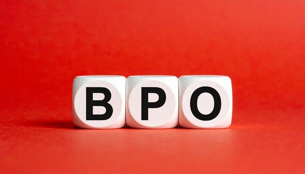 Three white cubes placed side by side against bright red background, each cube printed with single black letter forming acronym &ldquo;BPO,&rdquo; visually symbolizing business process outsourcing, relevant in bu