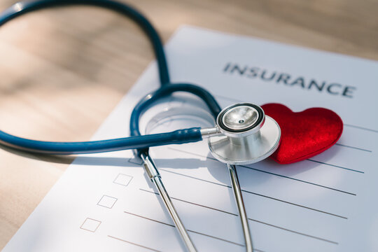 Health insurance concept. Stethoscope and red heart on insurance form represent medical coverage, policy, protection, healthcare, claim, security