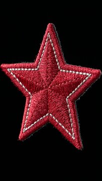 Red embroidered star patch with white stitching, isolated on
