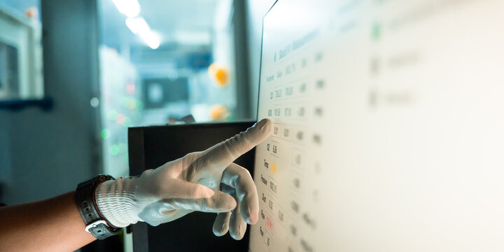 Close up hand energy environment engineer using AI computer control emission monitoring system for air pollution reduction. Technician using digital tablet analysis data clean air for sustainable 
