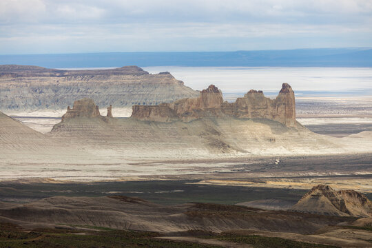 Aerial view of the dramatic limestone rock formations of Bozjyra in the vast desert landscape of the Ustyurt Plateau in Aktau, Mangystau Region, Kazakhstan.