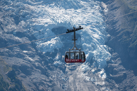 Brevent Cable Car Gondola Suspended in Front of Bossons Glacier in Chamonix, French Alps