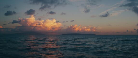 Fototapeta premium Calm Ocean Waters Reflecting Sunset Clouds at Dusk