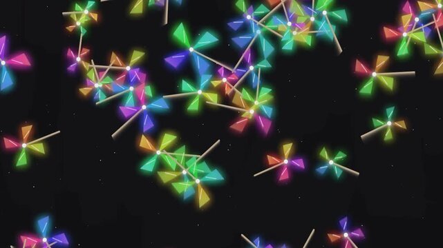 Glowing colorful spinning pinwheel toys floating in dark night sky motion background digital video animation