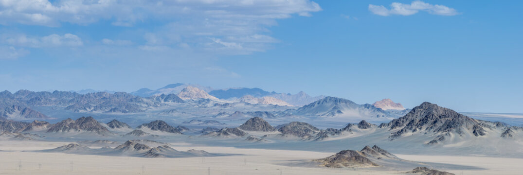 Aerial Panorama Of Rugged Mountain Range In Gobi Desert Landscape
