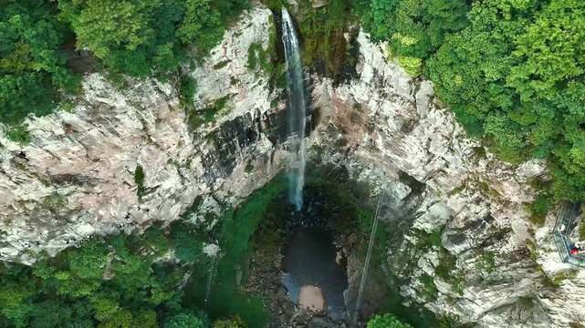 Static Aerial View of Via Ferrata Climbers Beside Xuedou Mountain Waterfall