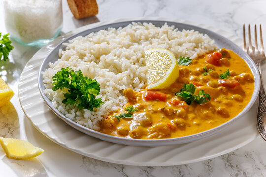 Creamy garbanzo bean curry with rice and lemon
