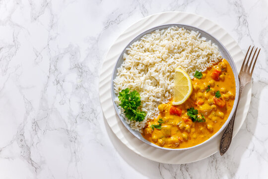 Vegan chickpea curry dish with rice top view