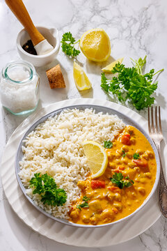 Creamy garbanzo bean curry with rice and lemon