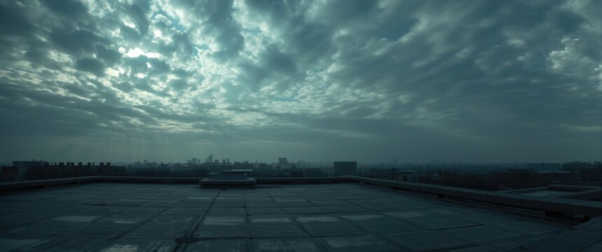 Urban Rooftop View with Dramatic Cloudy Sky in Cool Tones