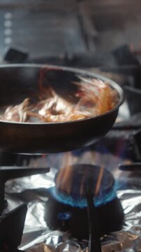 Tossing Langoustines in Frying Pan During Cooking