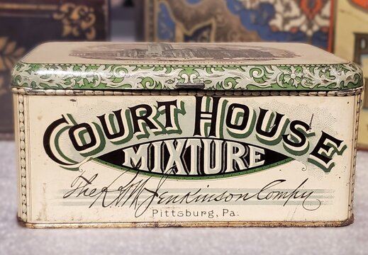 Pittsburgh, Pennsylvania, U.S.A - Jul 18, 2026 - Vintage Court House Mixture tin from A.M Jenkinson Company featuring ornate decorative artwork and historic Pittsburgh branding.