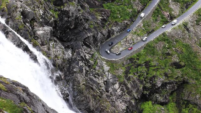 Vehicles driving on Trollstigen switchback road in Norway
