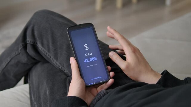 Mobile app showing a dark-mode CAD to USD market rate. The screen displays a clear 42.085 value. Perfect for traders, financial analysts, and currency investment dashboards.