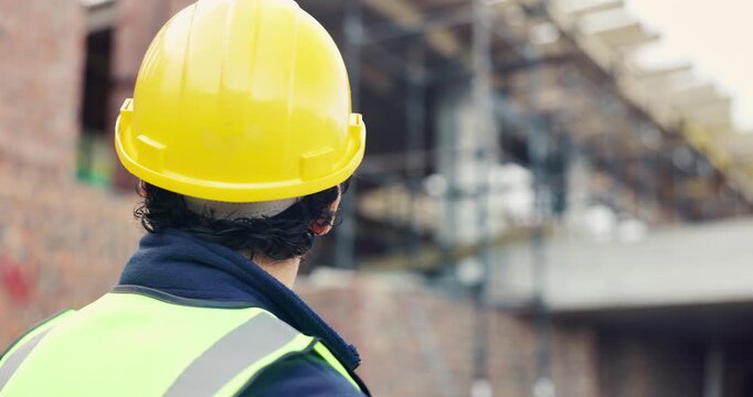 Construction, back and man with building inspection for masonry safety, progress and compliance. Helmet, civil engineer and monitor site development for defect management, quality control and project