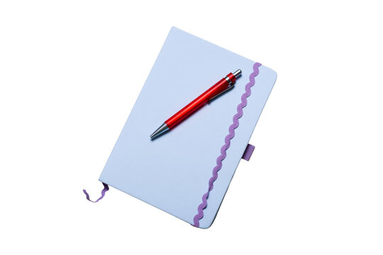 Close-up angled perspective of a light purple journal with a red pen resting on its cover