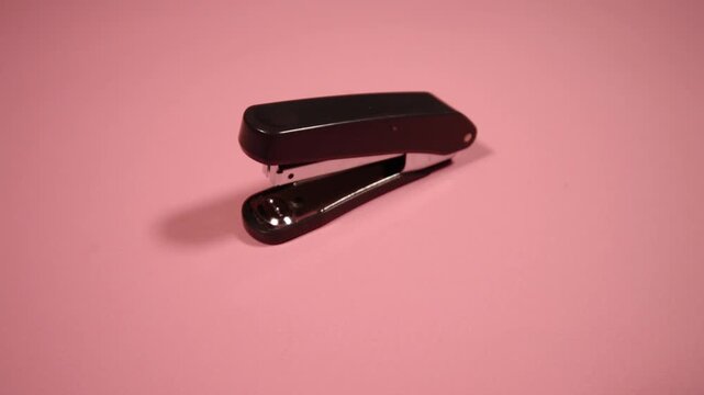 Red Stapler with Metal Staples and Paper Clips Isolated on White Background, Office Stationery Equipment and Business Workspace Tool Concept