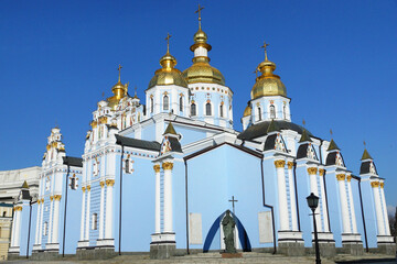  Saint Michael's Golden-Domed Monastery in Kyiv Ukraine with its striking blue walls and gleaming golden domes set against a clear blue sky.  © Mariana