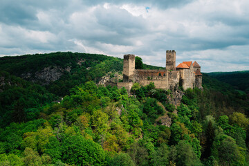 Hardegg castle rising above the forested Thaya valley in Thayatal National Park, Lower Austria, under a dramatic spring sky © Othmar