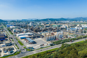 Fototapeta premium Aerial view of a large modern petrochemical plant with storage tanks and processing facilities in China
